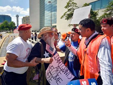 A man with the Guardian Angels safety patrol pulls Casa Gaytan, left, as he argued with a...