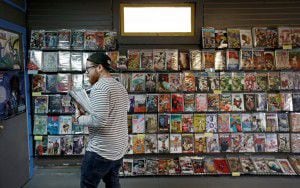  Customer Justin Gorbey shops at Red Pegasus Games and Comics on Wednesday in Dallas. (Jae...