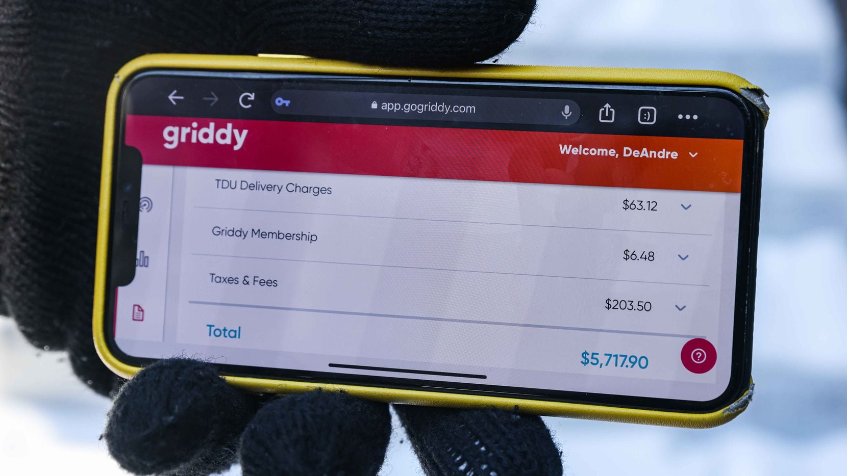 DeAndré Upshaw shows a $5,000 bill from Griddy on his cellphone for his 900-square-foot...