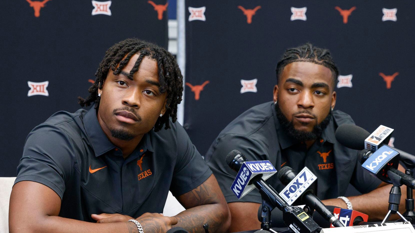 Texas defensive back Jahdae Barron (left) and linebacker Jaylan Ford listen to a question...