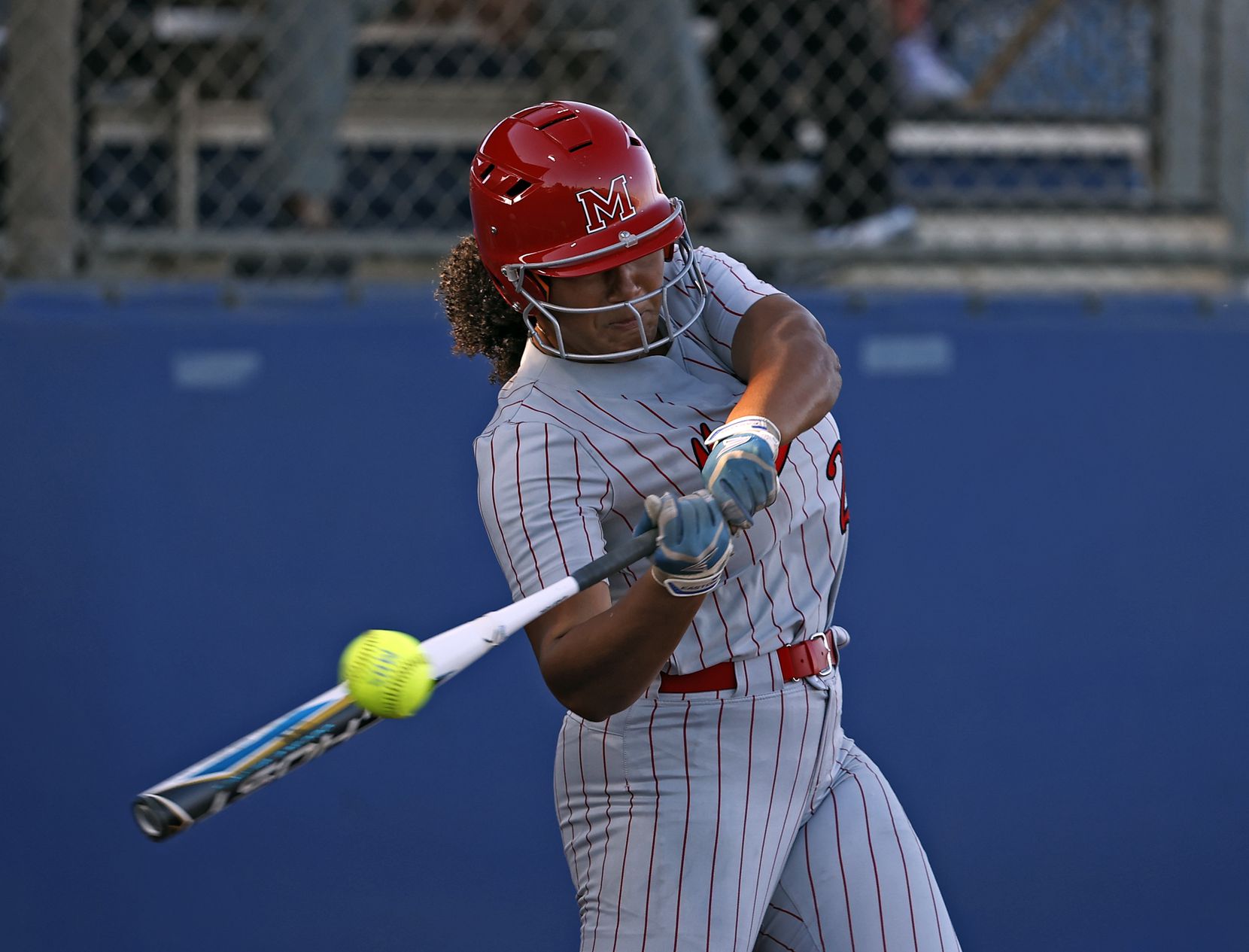 Flower Mound Marcus' Tori Edwards (24) swings at the pitch during the game against El Paso...