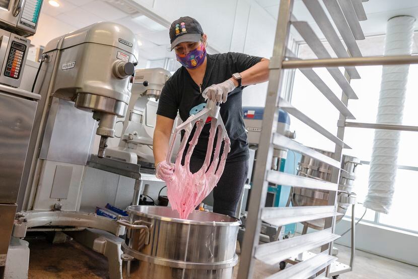 Owner and pastry chef Tida Pichakron mixes macaron batter in her kitchen at Haute Sweets...