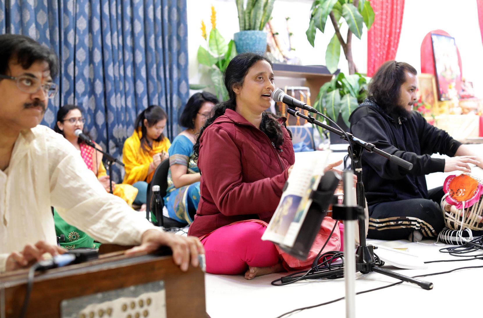 Community members perform music during the Diwali “Festival of Lights” event at the Radha...