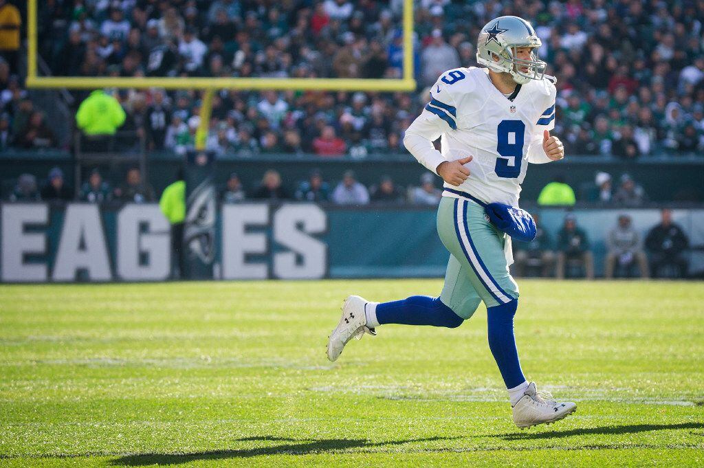 Dallas Cowboys quarterback Tony Romo (9) checks into the game during the first half of an...