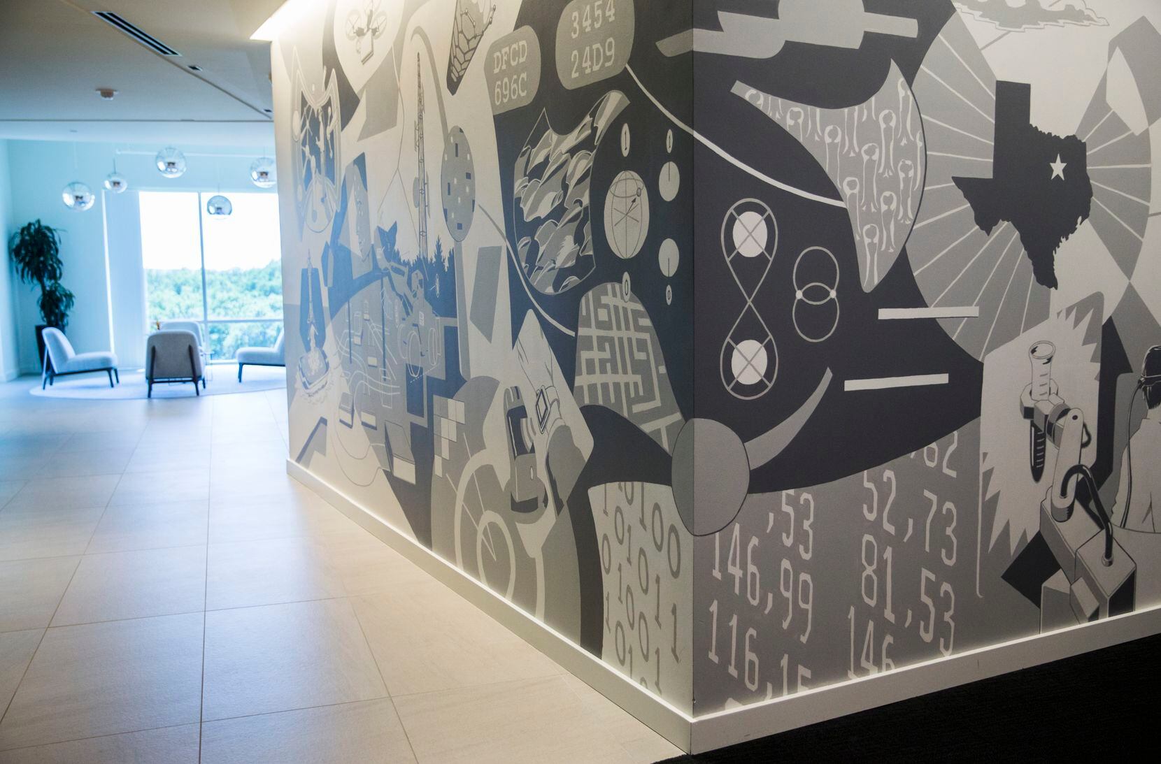 Wipro, an India IT company with 1,200 employees in Texas, opened a digital innovation center in Plano in 2019. This is one of the center's common spaces with a custom mural.
