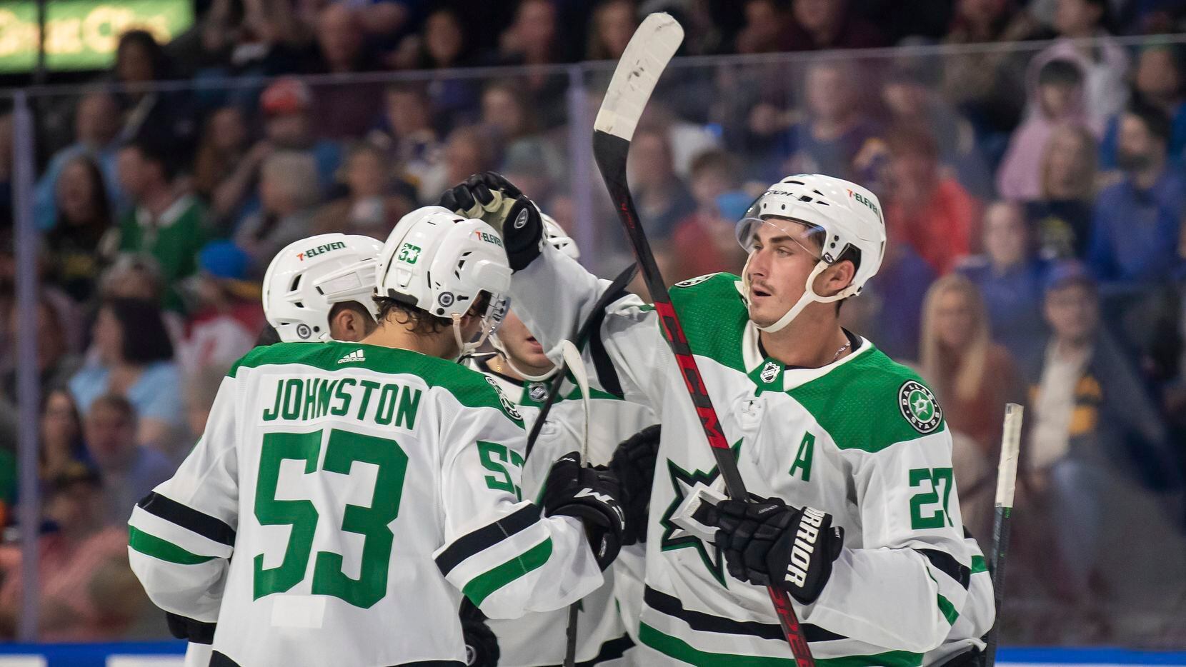 Dallas Stars left wing Mason Marchment (27) celebrates with teammates after scoring a goal...
