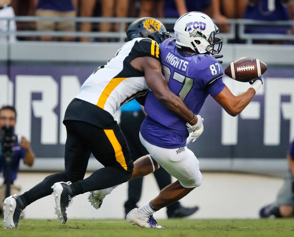 TCU Horned Frogs wide receiver TreVontae Hights (87) looses the ball while running for the...