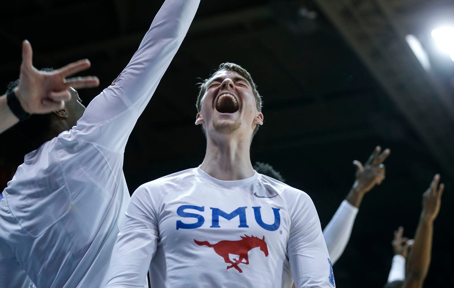 Southern Methodist Mustangs guard Tyler Lundblade (4) cheers during the second half of the...