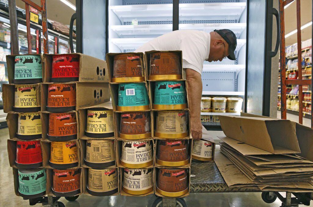 Robert Horton, route supervisor for Blue Bell Ice Cream, fills the refrigerated ice cream...
