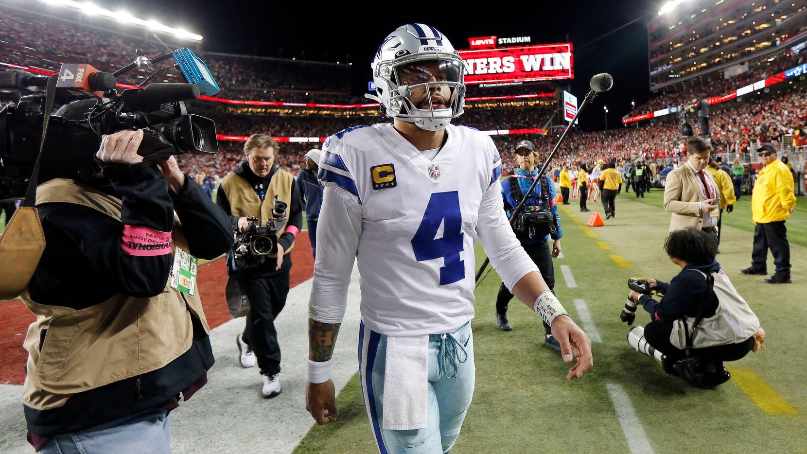 Dallas Cowboys quarterback Dak Prescott (4) walks off the field following their loss to the...