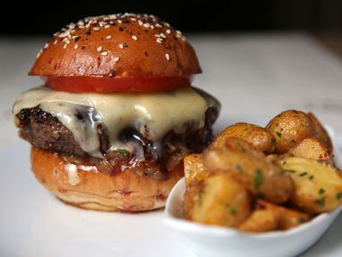 C.A.B. Burger with duck-fat potatoes at Sixty Vines 