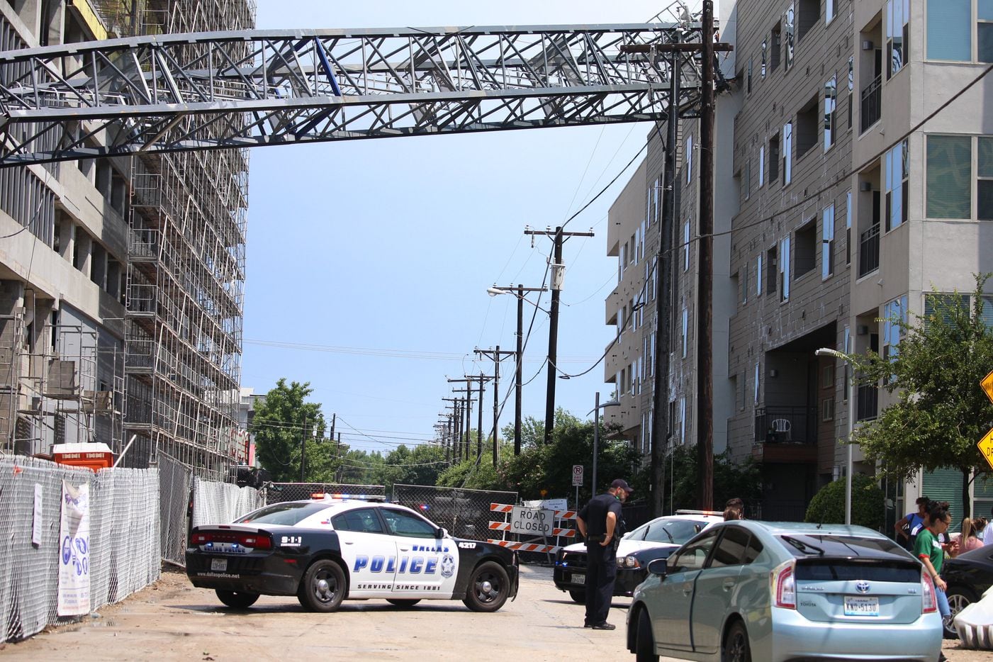 Officials responded after a crane collapsed into the Elan City Lights apartments in Dallas...