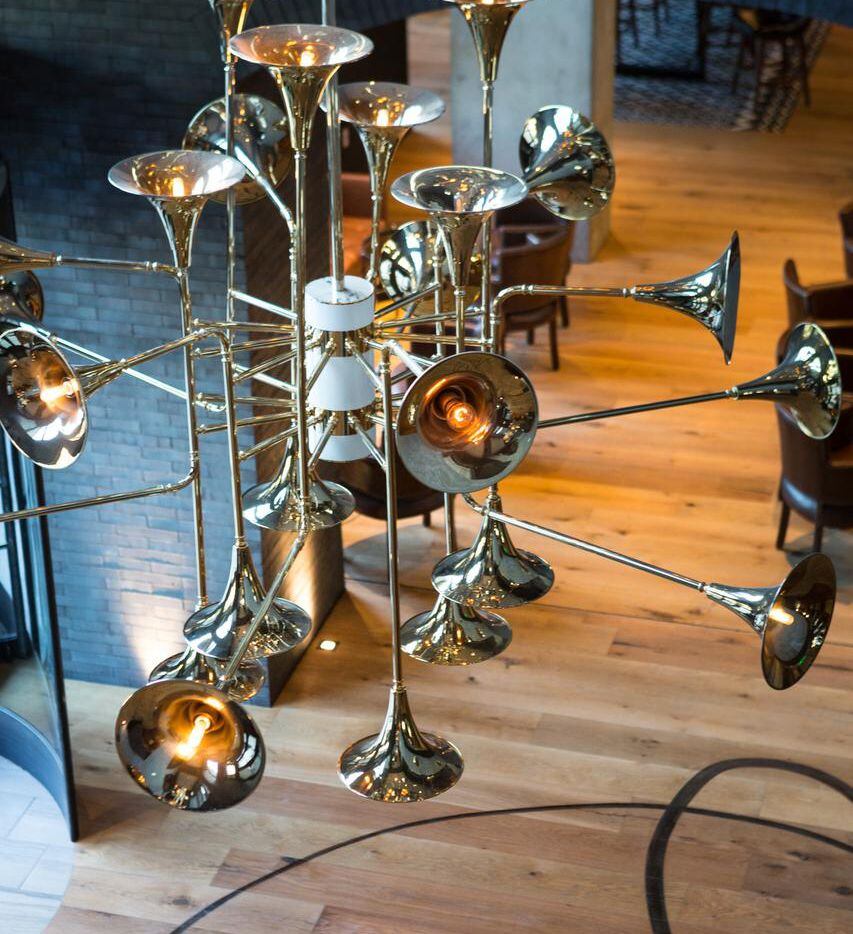 Horn-inspired  chandeliers hang from the ceiling in the hotel’s lobby.