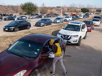 Healthcare worker Tonya Gallow administers a COVID-19 test in the parking lot of  Friendship-West Baptist Church in south Dallas, on Thursday, Jan. 06, 2022. The testing site is partnering with Zoom Medical Testing and Sunshine Labs to host the free rapid testing site.