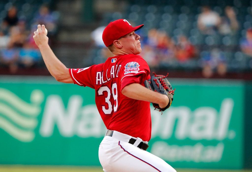 Texas Rangers relief pitcher Kolby Allard throws to the Los Angeles Angels in the first...