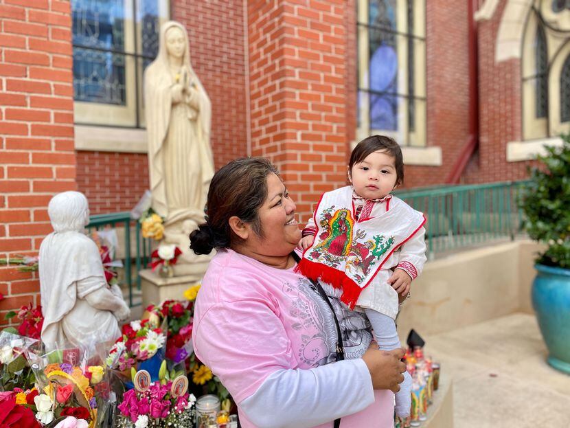 Zoyla Hernández, 46, with her grandson Santiago Esparza, 1, at Cathedral Guadalupe.
