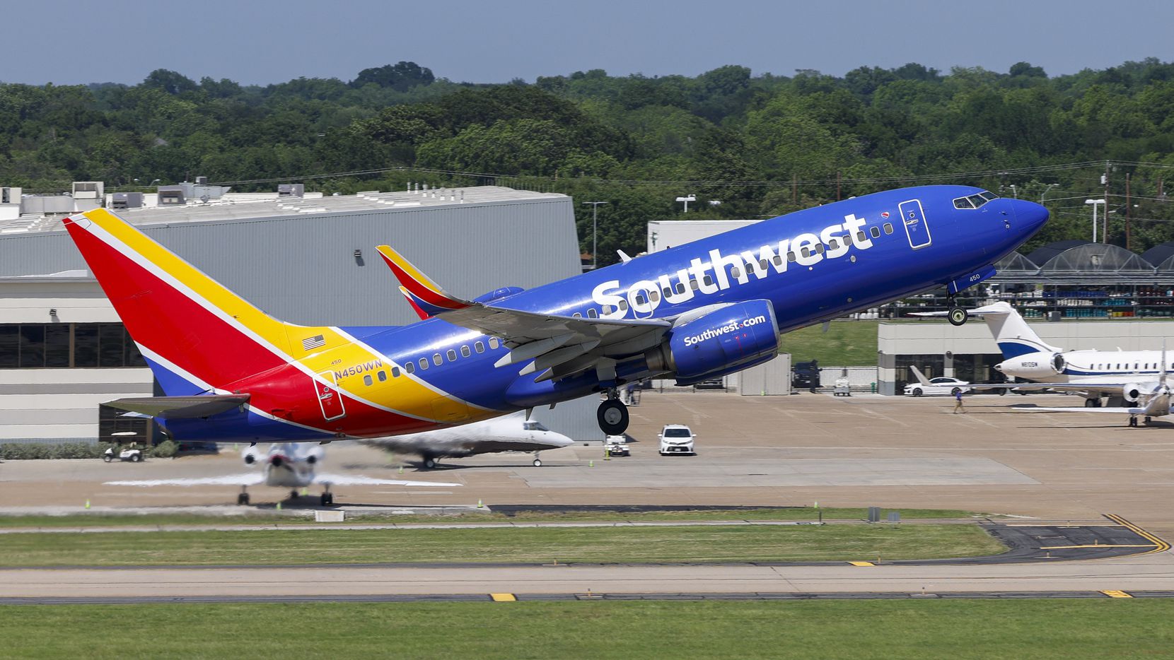 A Southwest Airlines flight takes off from the 13L/31R runway on the Lemmon Avenue side of...