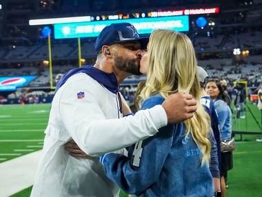 Dallas Cowboys quarterback Dak Prescott kisses his girlfriend Natalie Buffett before an NFL...