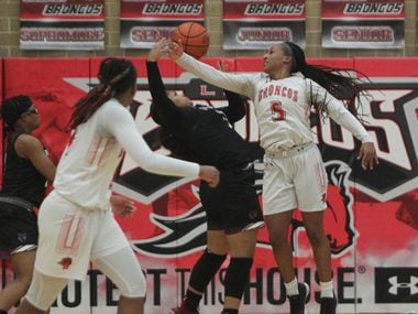 Mansfield Legacy guard Savannah Catalon (5) battles Mansfield Timberview post Trinity King (32) for a rebound during second half action. The two teams played their District 8-5A girls basketball game at Mansfield Legacy High school on January 22 , 2021.