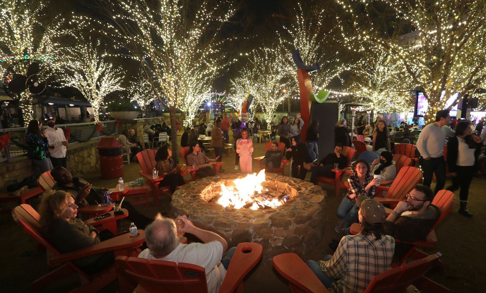 Guests celebrate New Years Eve at ArtPark Trinity Groves in Dallas, TX, on Dec. 31, 2021. ...