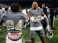 South Oak Cliff football players Joshua Manley (right) and Jordan Mayes (84) celebrate their...