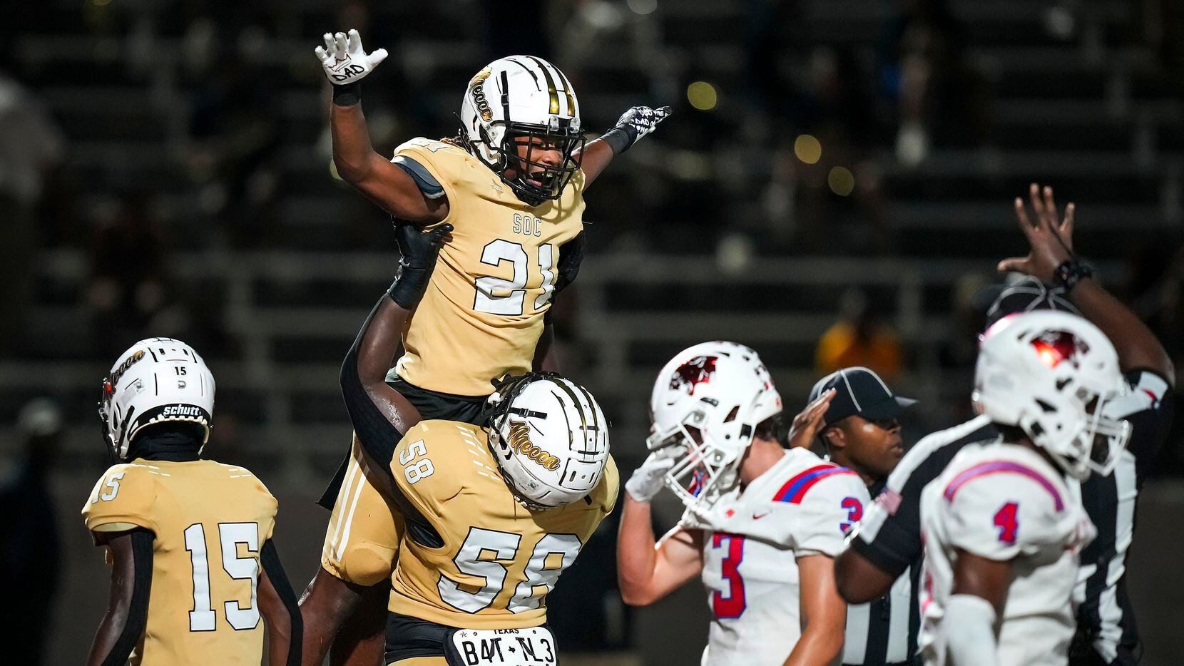 South Oak Cliff running back Danny Green (21) celebrates with offensive lineman Bryon Abner...