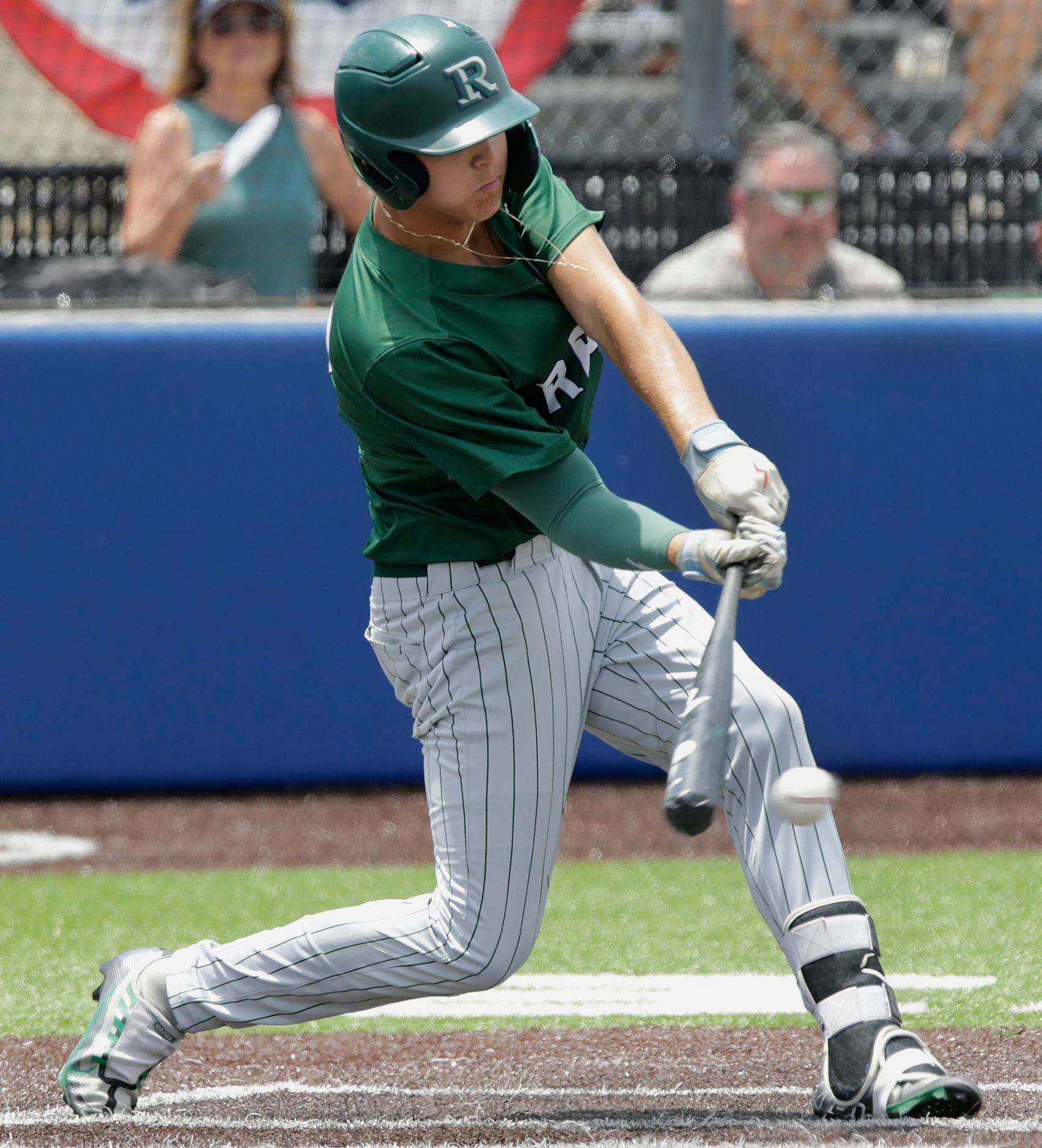 Reedy High School first baseman Kyle Olson (22) makes contact in the fifth inning as Reedy...