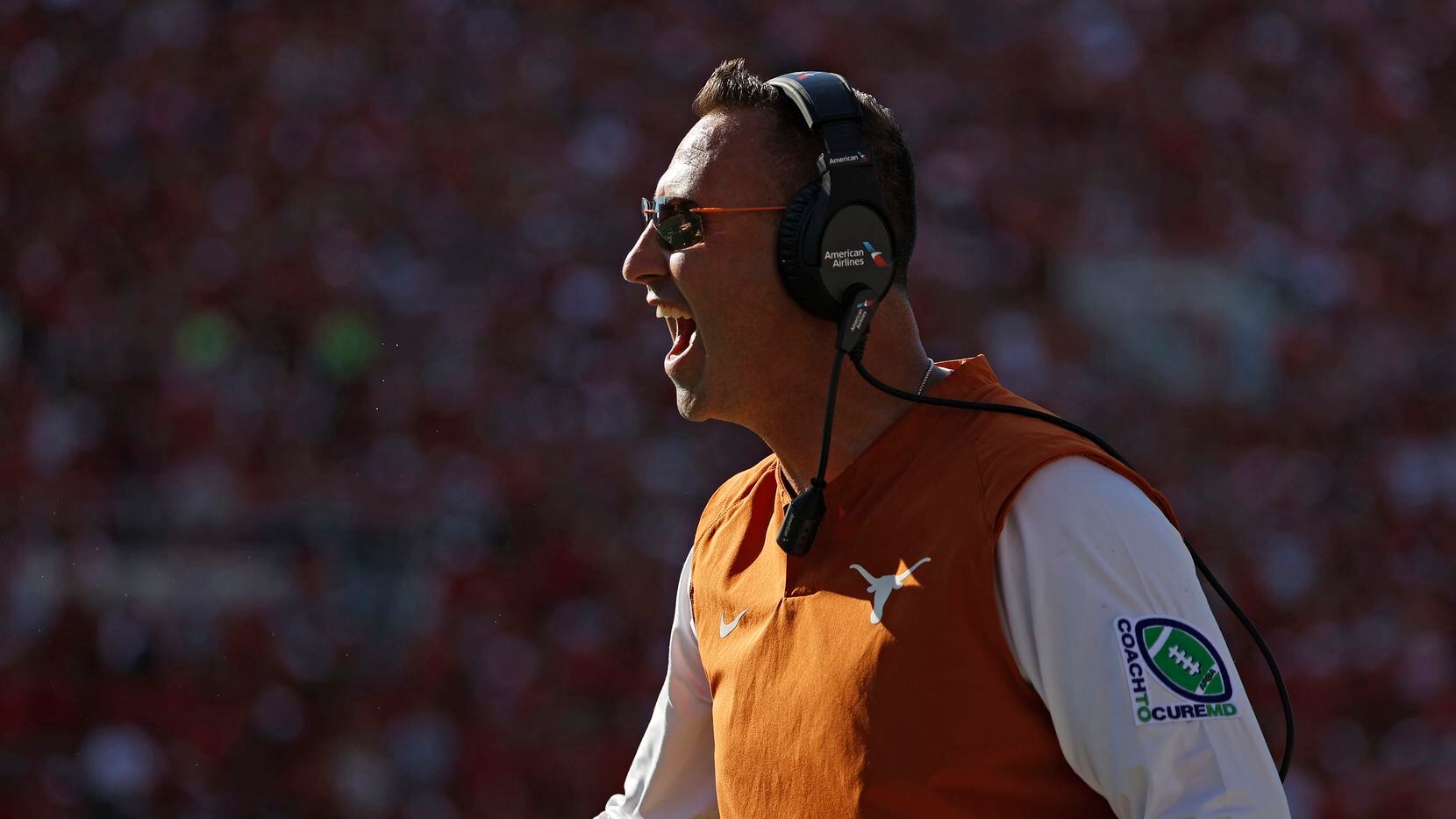 Texas coach Steve Sarkisian yells to his players during the second half of an NCAA college...