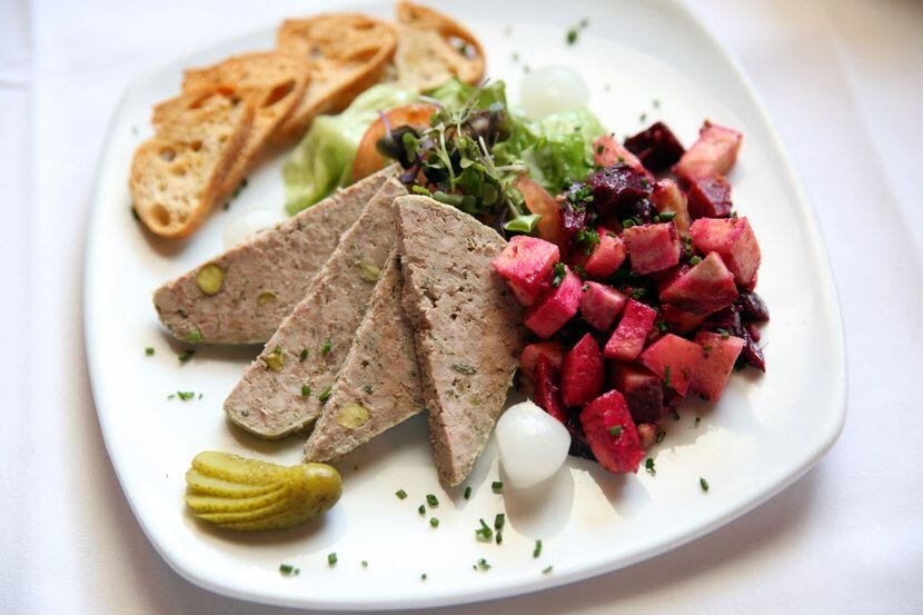 Saint-Emilion 's pistachio-studded house-made duck pate is served with cornichons and a...