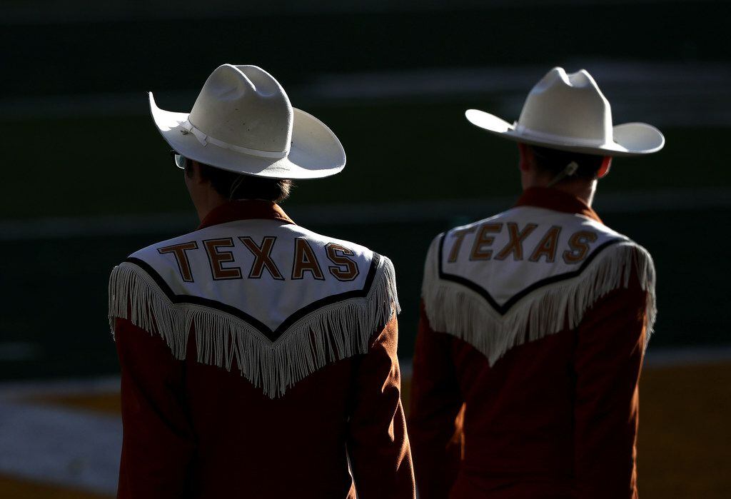 WACO, TEXAS - NOVEMBER 23:  Members of the Texas Longhorns band watch play between the Texas...