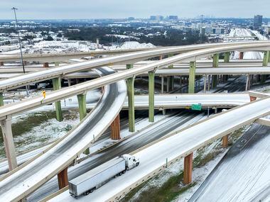 An icy mix covers the High Five Interchange at US 75 and I-635 on Tuesday, Jan. 31, 2023, at...