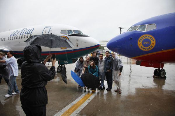 Southwest Airlines employees just say “when” for a Love Field photo celebrating their...