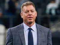 Troy Aikman walks the field prior to an NFL matchup between the Dallas Cowboys and the Los...
