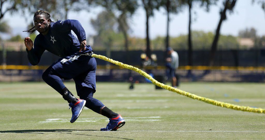 Dallas Cowboys rookie outside linebacker Jaylon Smith works on a resistance cord as he...