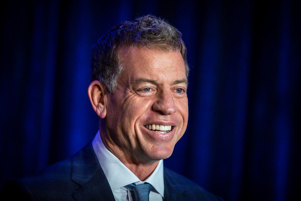 Troy Aikman is interviewed after an appearance at Children's Medical Center Dallas on...