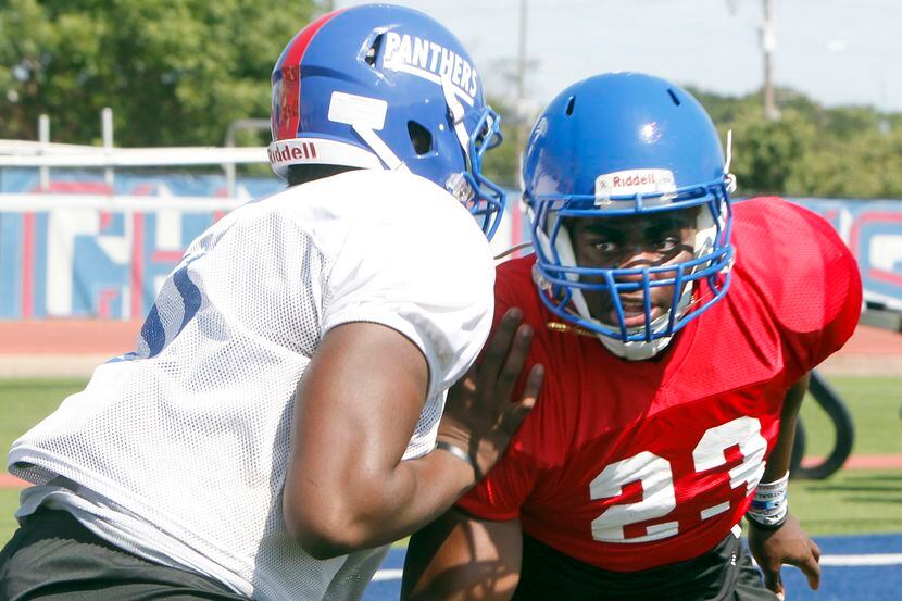Duncanville Panthers defensive lineman Omari Abor (23) eyes the quarterback as he works...