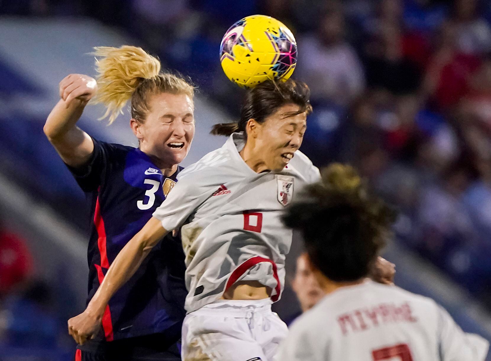 USA midfielder Samantha Mewis challenges Japan midfielder Hina Sugita (6) for a header...