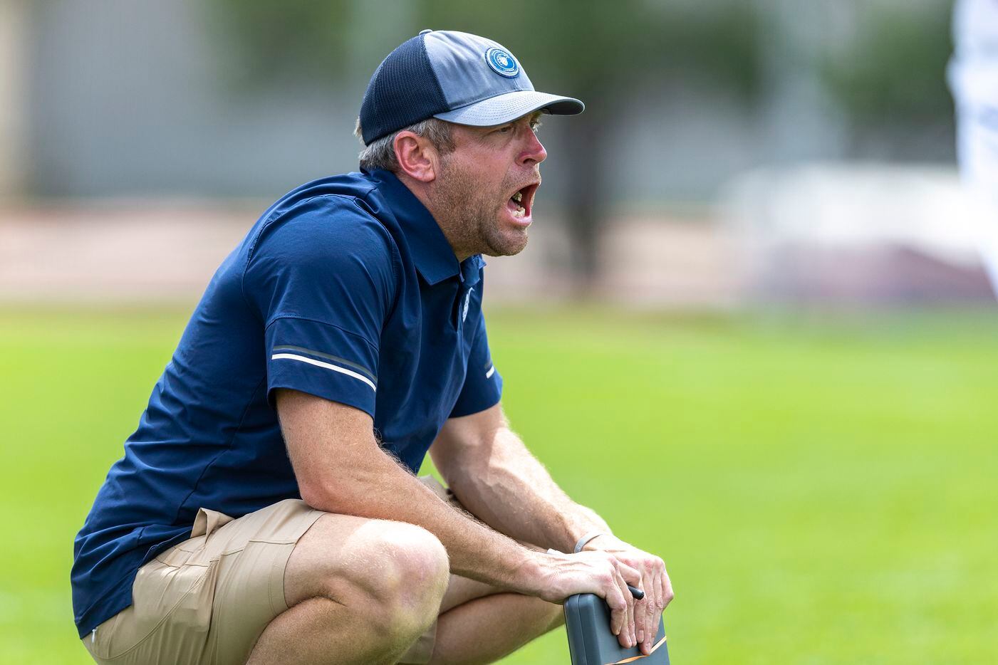 Episcopal School of Dallas head coach Jay Sothoron calls out to his players as they compete...