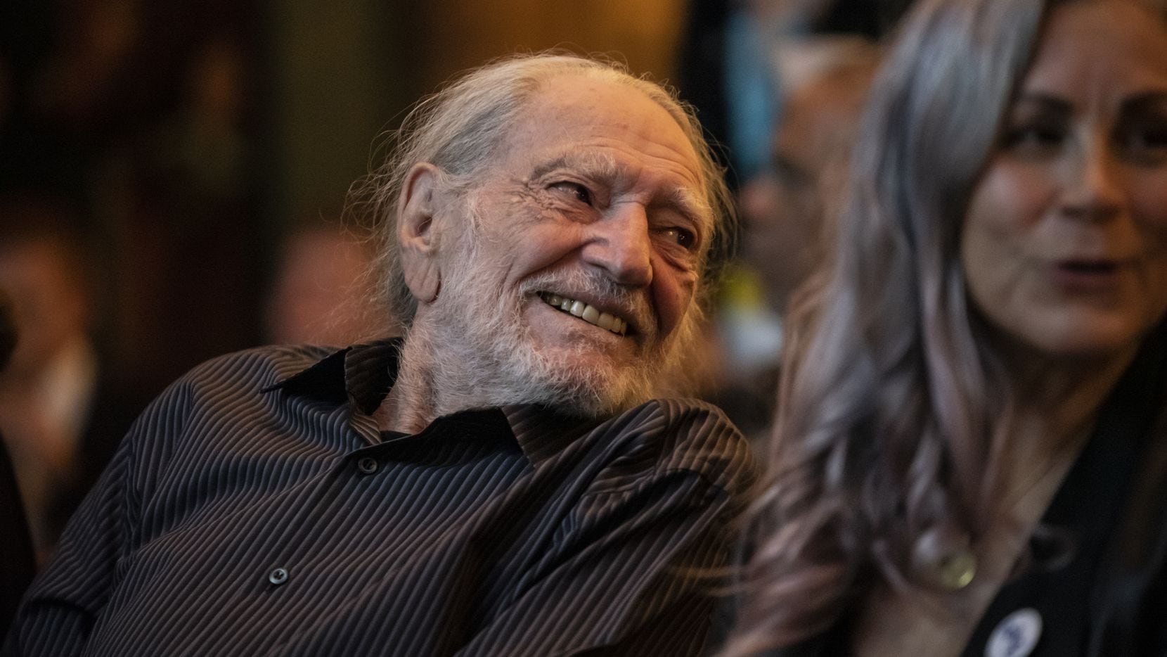 Willie Nelson laughs after arriving at The Texas Tribune Festival on Sept. 28, 2019 in...