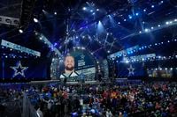 The Dallas Cowboys announce a pick during the third round of the NFL football draft, Friday,...