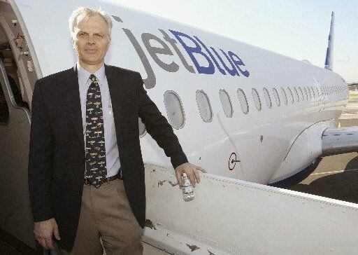 FILE photo shows David Neeleman standing beside a JetBlue A320 airliner at the Burbank...