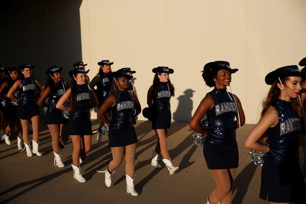 Frisco Lone Star Rangerettes walk onto the field before a football game in Denton on Sept....