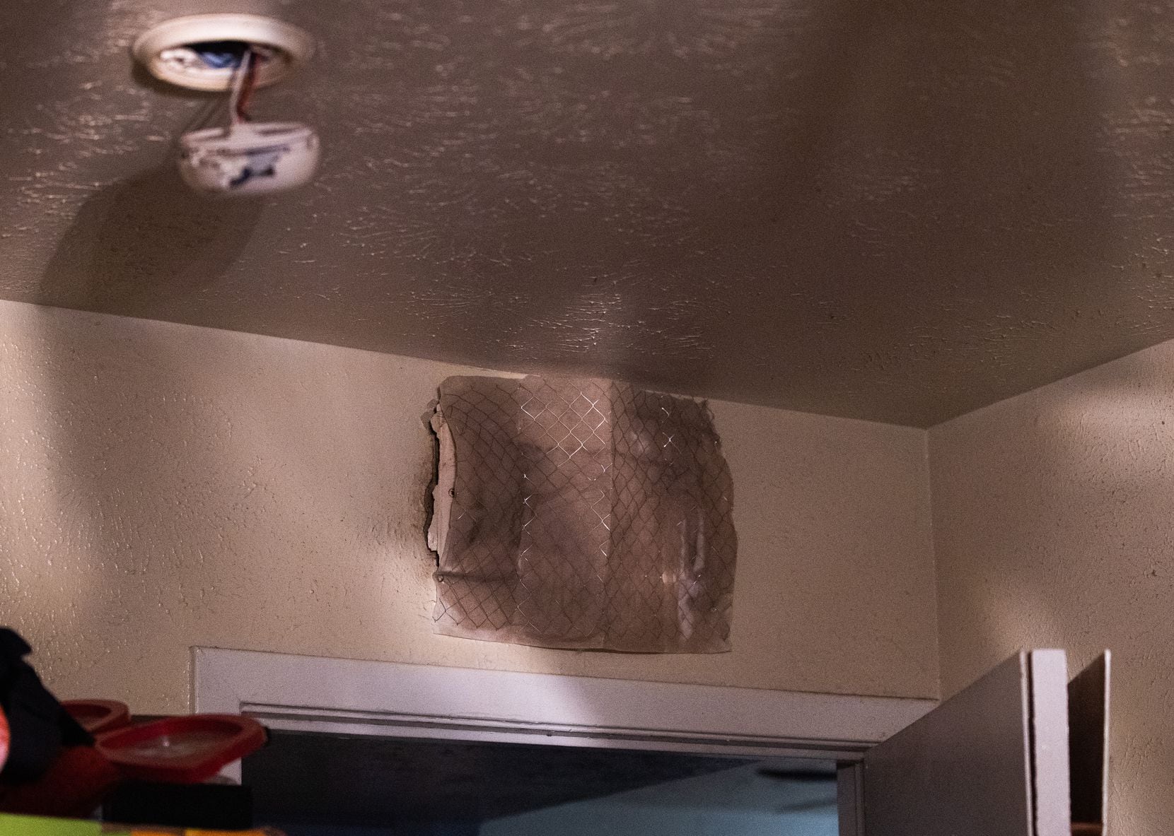 A homemade filter has been placed over an air vent that is covered in mold inside Theresa...