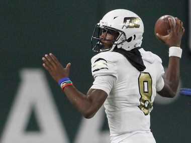 South Oak Cliff quarterback Kevin Henry-Jennings (8) prepares to launch a pass downfield...