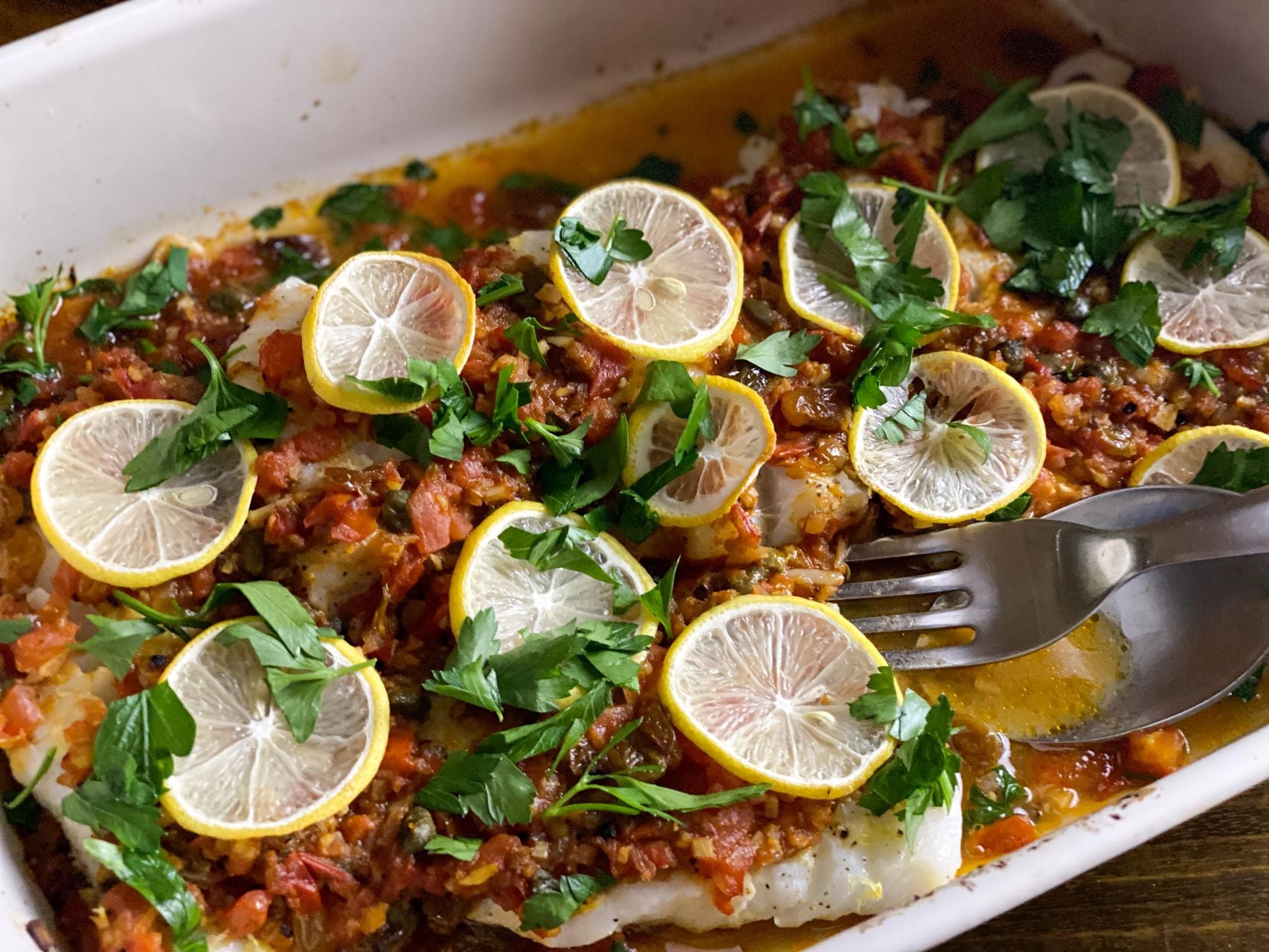 Saucy Tomato Baked Cod with Garlic, Capers and Raisins from The Mediterranean Dish, by Suzy...