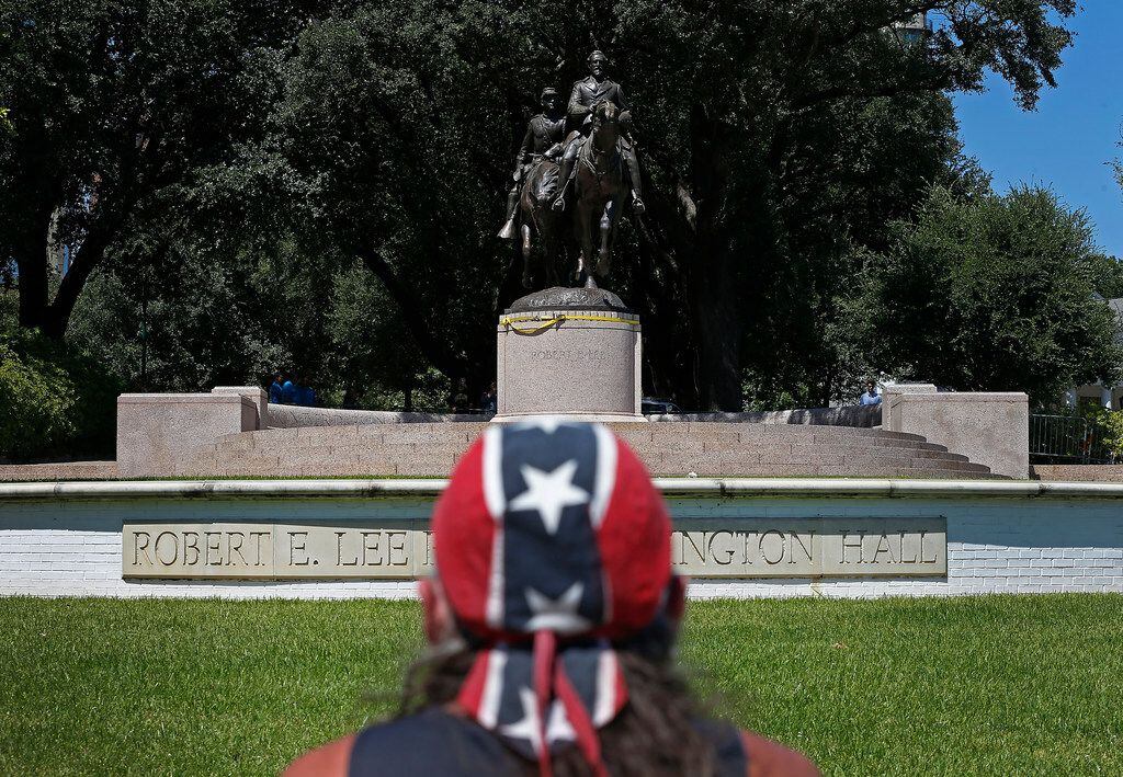 Johnny Carpenter looks at the statue of Robert E. Lee that still stands in Oak Lawn almost a...