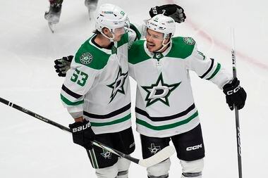 Dallas Stars center Wyatt Johnston, left, congratulates center Logan Stankoven after he...