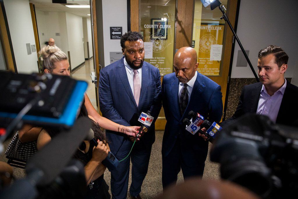 Attorneys Lee Merritt (left) and Daryl Washington spoke to reporters in the hallway outside...