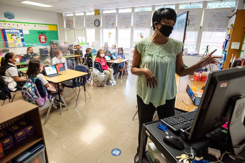 Second-grade teacher Michelle Jones conducts a lesson in her classroom at Tom Gooch...