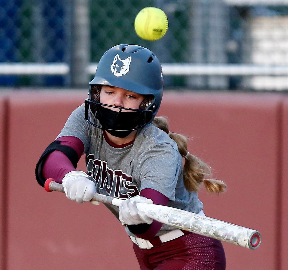Heritage pitcher Jensin Hall (51) pops out on a bunt attempt in the second inning as Heritage High School hosted Memorial High School for the District 9-5A softball championship in Frisco on Tuesday, April 20, 2021. (Stewart F. House/Special Contributor)